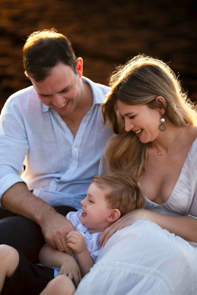 Family photo young couple with toddler son playing on the beach during sunset in Brisbane 32 768x1152
